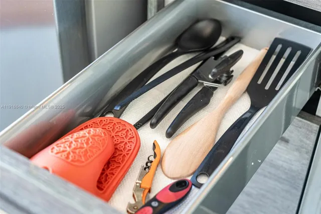 a kitchen with stainless steel appliances granite countertop a refrigerator and a stove