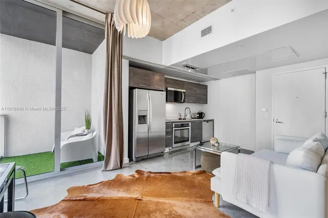 a living room with furniture and a table