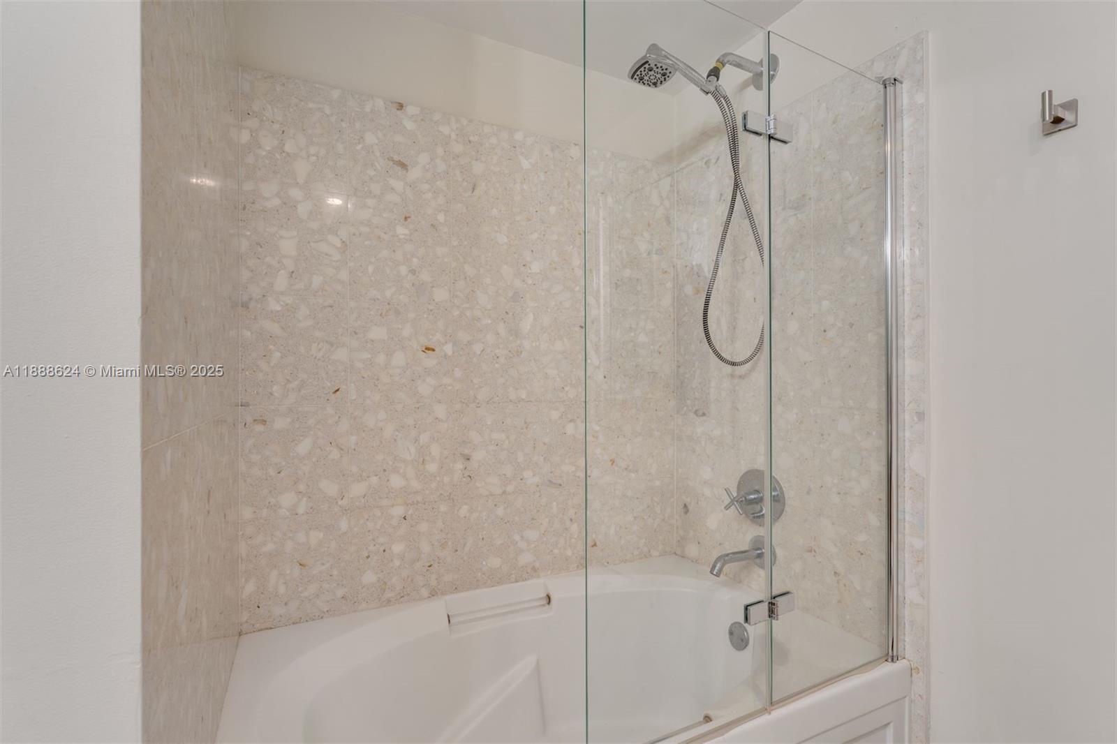 185 Southwest 7th Street, Unit 3605 Miami, FL 33130 - Photo 19 of 24 a bathroom with a shower and a bath tub