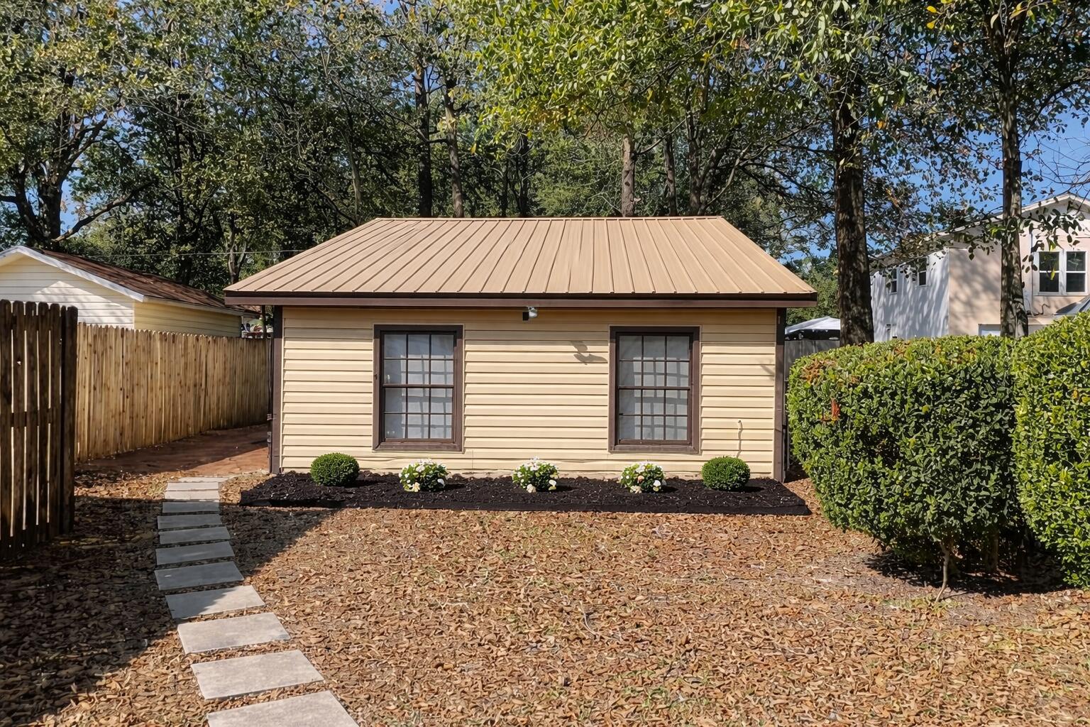 909 A Mapoles Street Crestview, FL 32536 - Photo 1 of 8 a front view of a house with garden