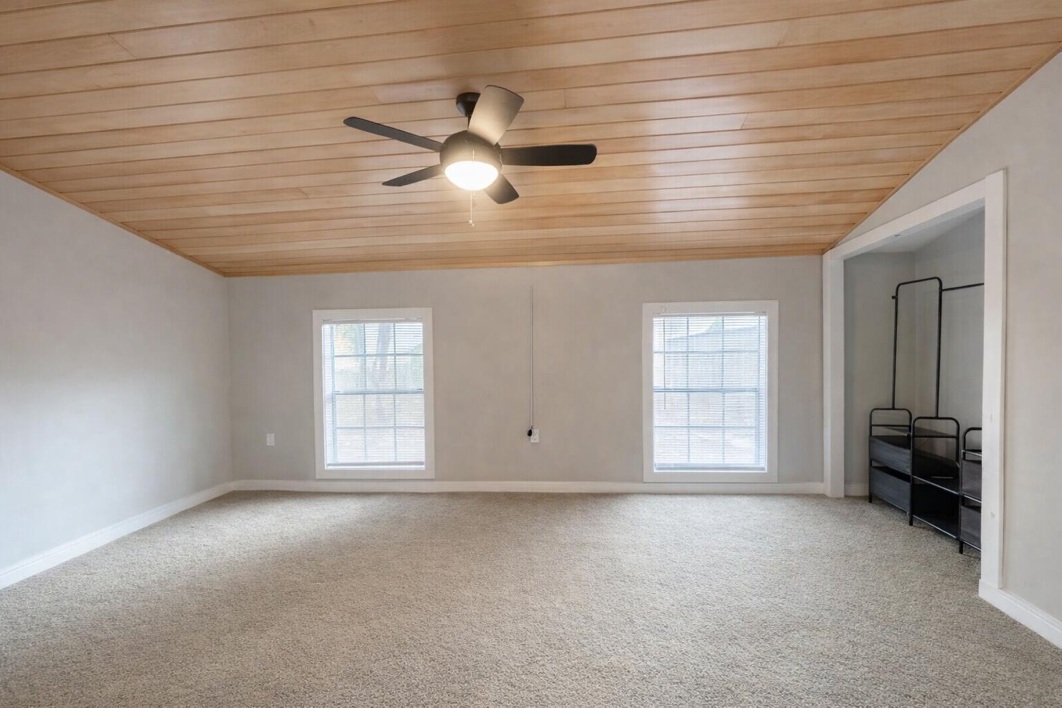 909 A Mapoles Street Crestview, FL 32536 - Photo 6 of 8 an empty room with windows and cabinet