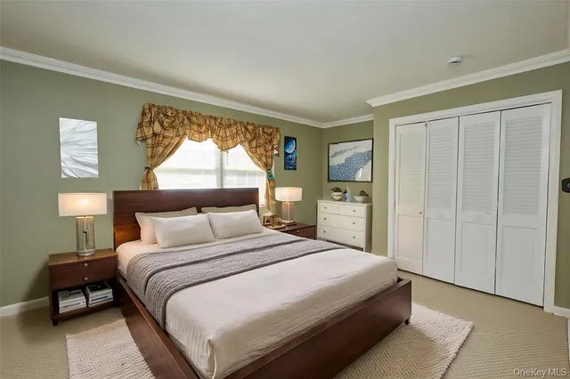 a bedroom with a bed and a lamp