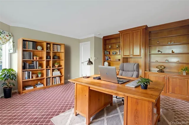 a view of a workspace with furniture and cabinet