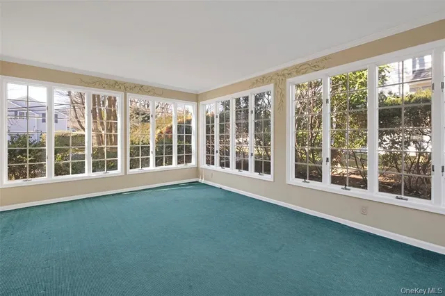 a view of an empty room with a large window