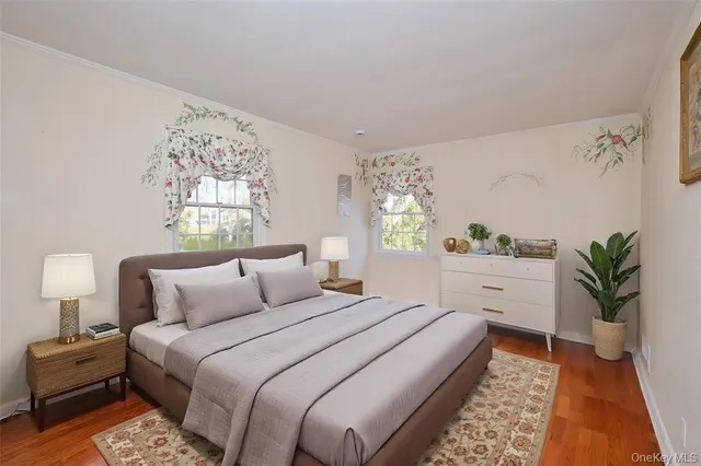 a bedroom with bed and a window