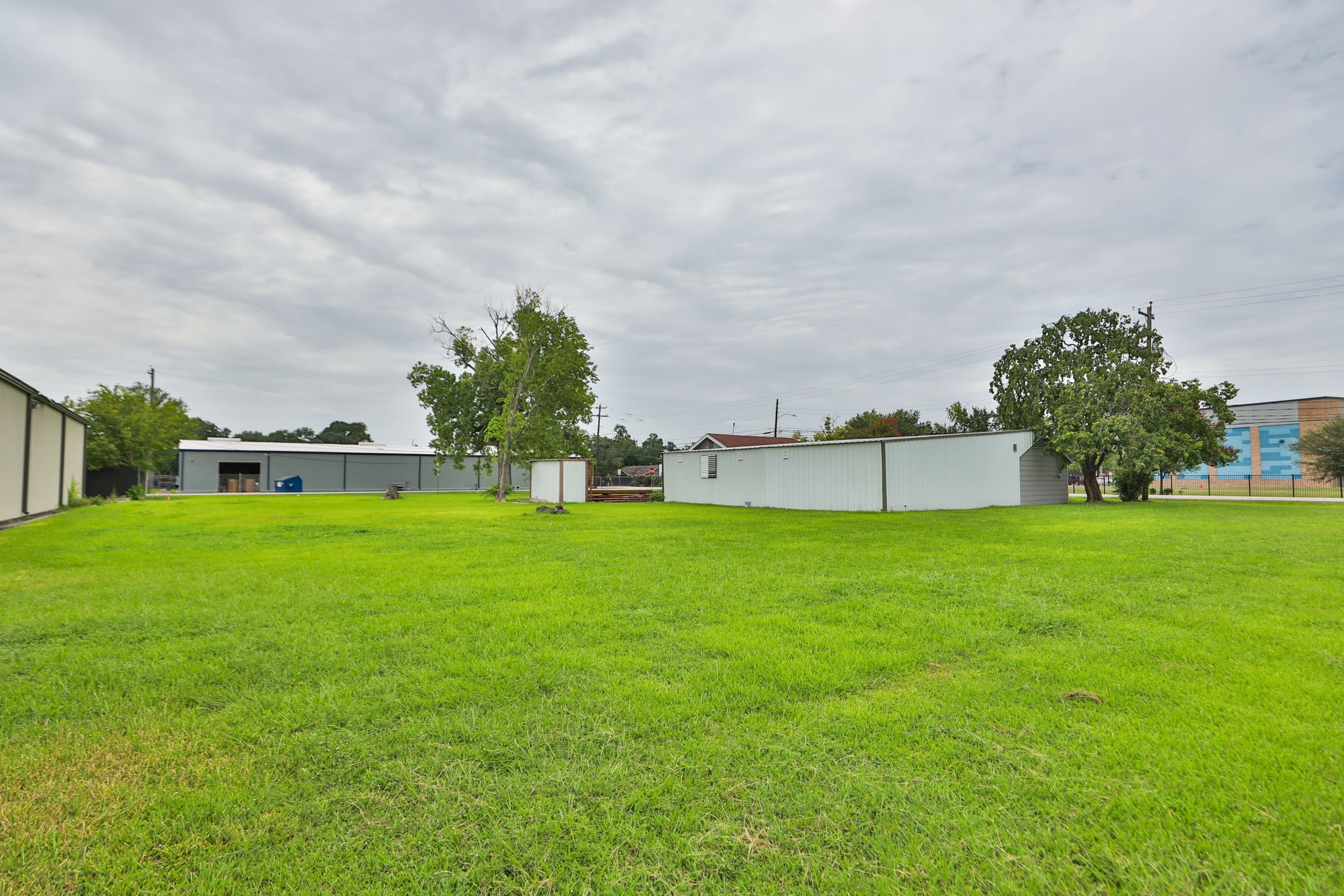 14023 Packard Street Houston, TX 77040 - Photo 22 of 33 a view of a house with a big yard and a large tree