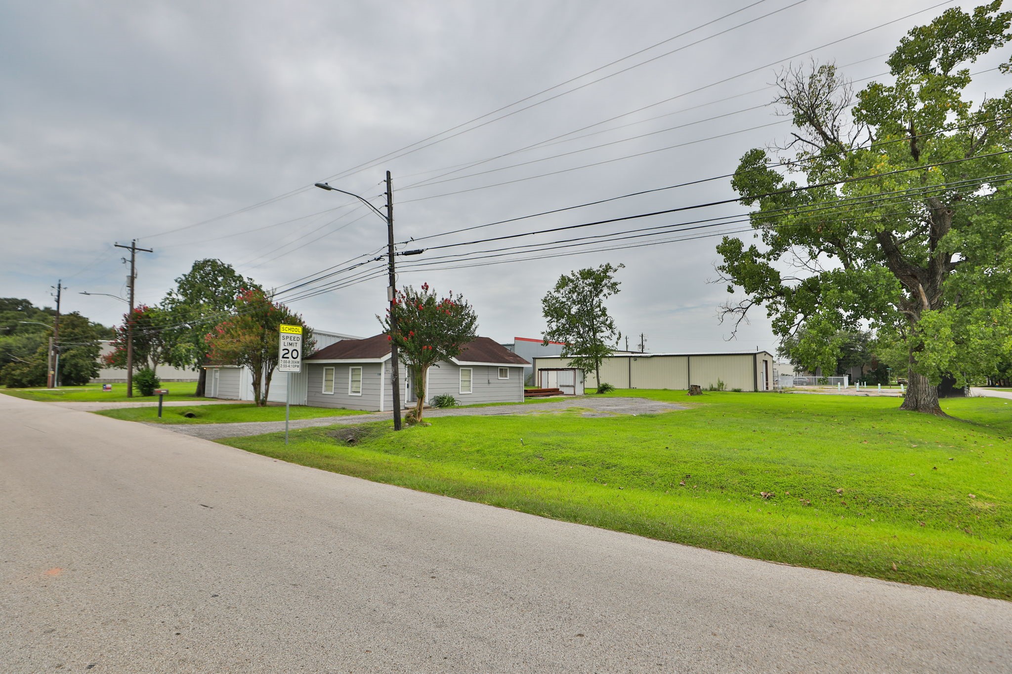 14023 Packard Street Houston, TX 77040 - Photo 27 of 33 a view of a house with a big yard and potted plants