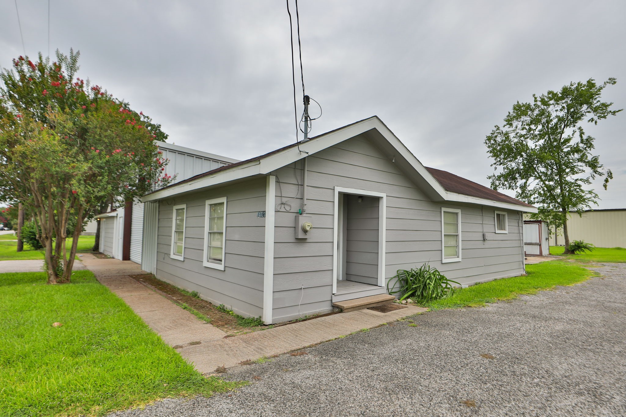 14023 Packard Street Houston, TX 77040 - Photo 29 of 33 a front view of house with yard and trees