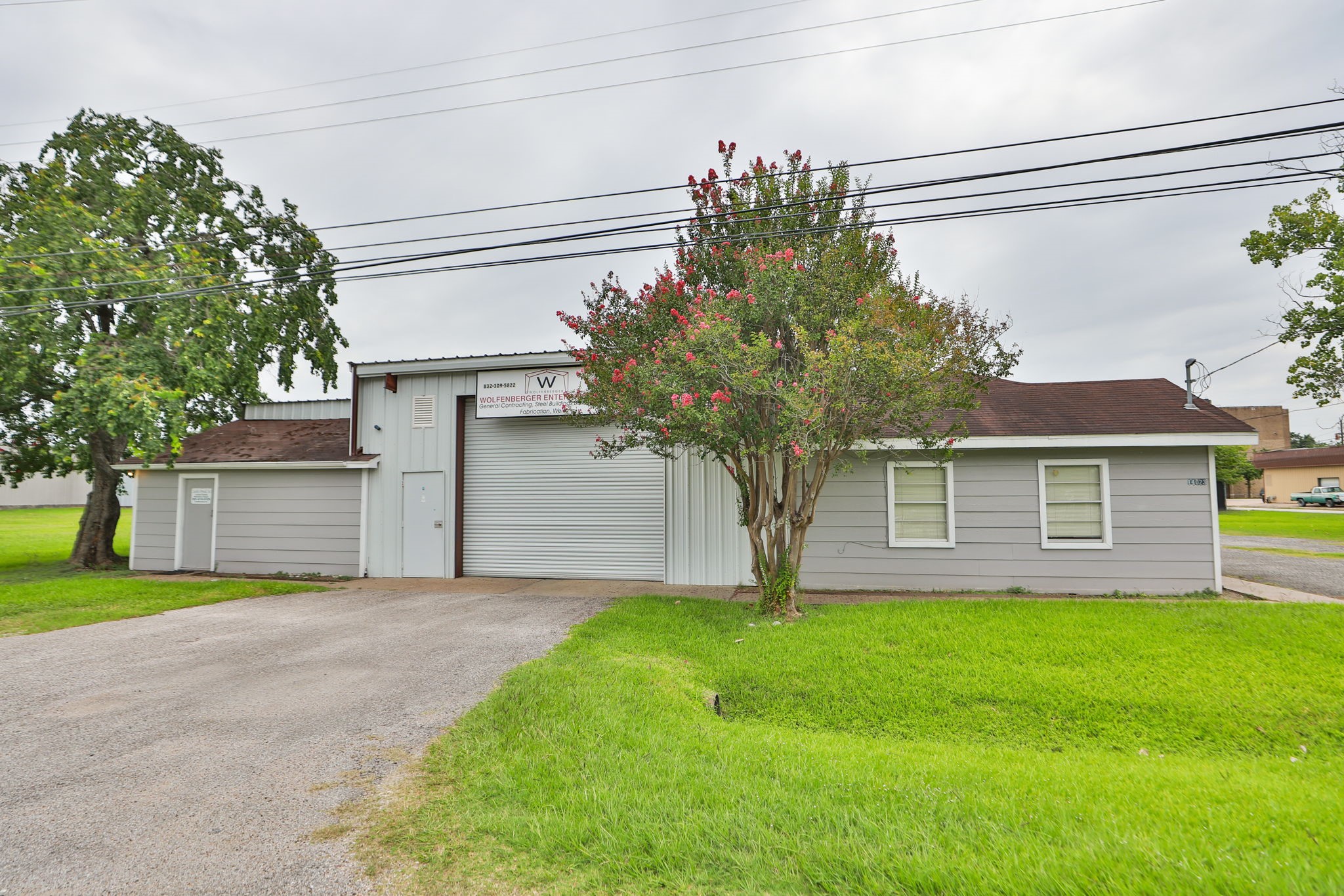 14023 Packard Street Houston, TX 77040 - Photo 30 of 33 a front view of a house with a yard and garage