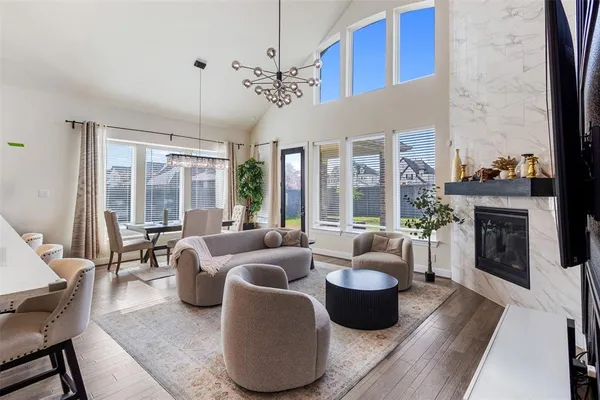 a living room with furniture or fireplace and a chandelier