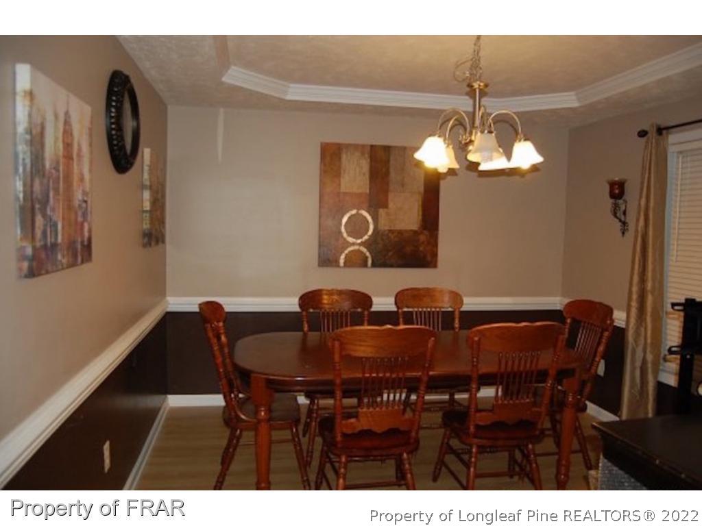 62 Robeson Court Spring Lake, NC 28390 - Photo 4 of 19 a view of a dining room with furniture and chandelier