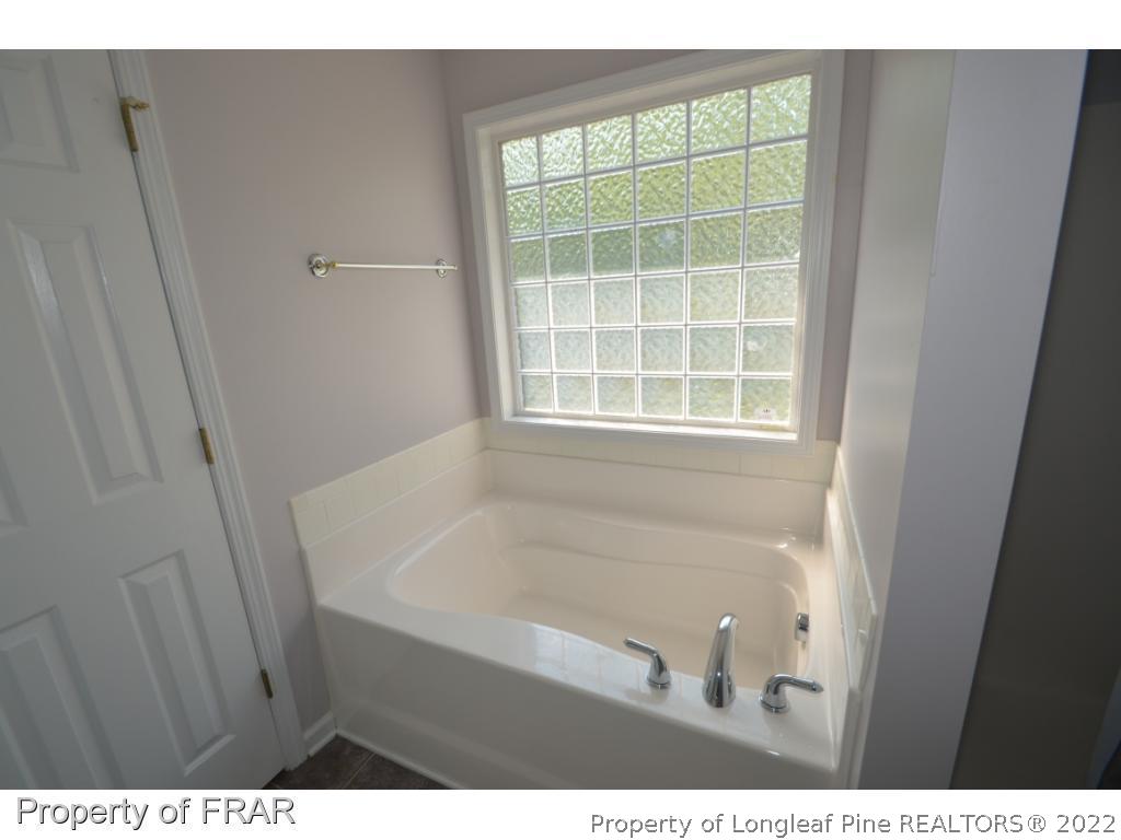 62 Robeson Court Spring Lake, NC 28390 - Photo 8 of 19 a bathroom with a sink and a window