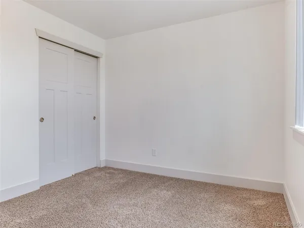 an empty room with closet