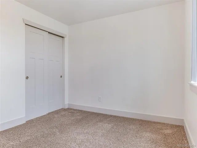 an empty room with closet