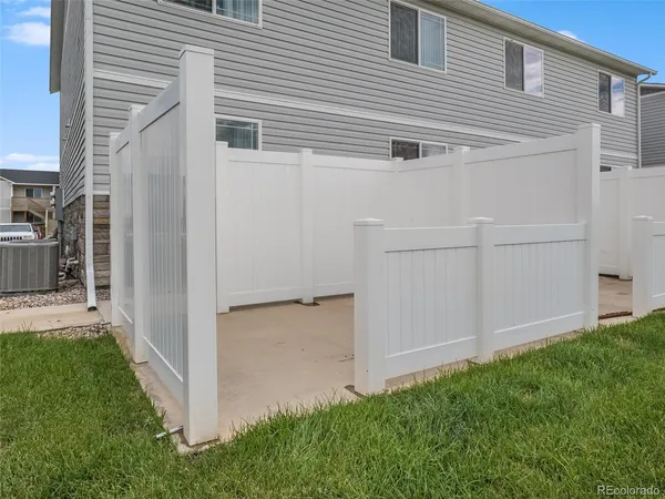 a view of a backyard with plants and a garden