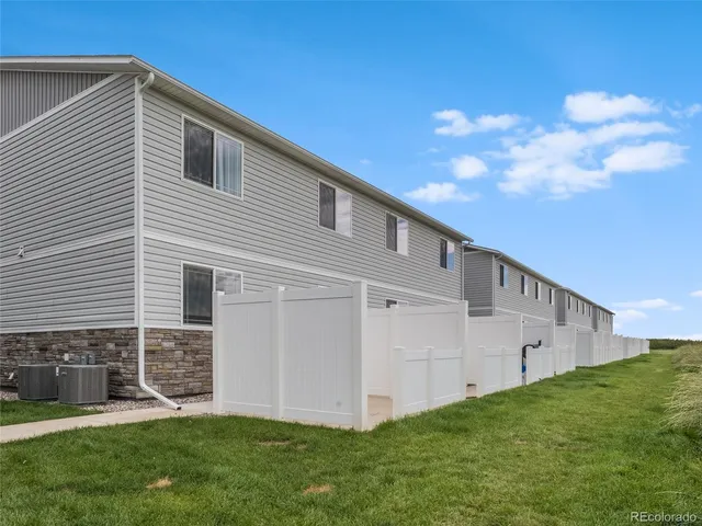 a view of a swimming pool and an outdoor seating