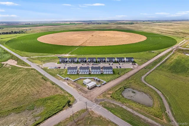 a view of a swimming pool and an outdoor seating