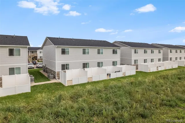an aerial view of a house with outdoor space