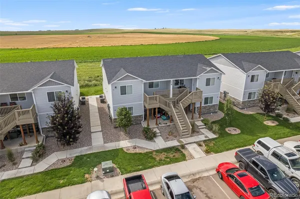a front view of house and yard with seating space