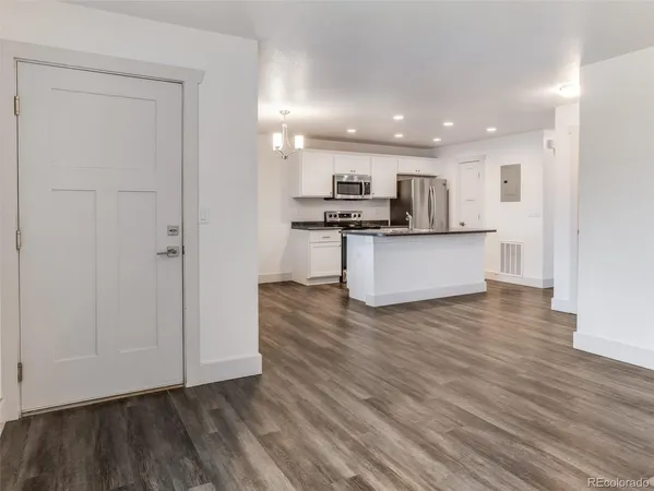 a view of kitchen with wooden floor and window