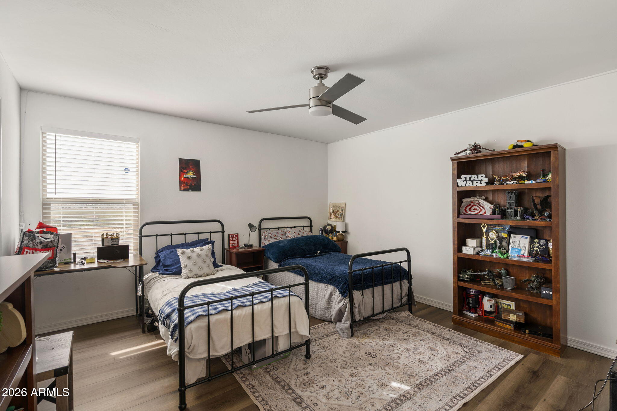3142 Pineapple Road San Tan Valley, AZ 85143 - Photo 12 of 21 a bedroom with furniture and a book shelf