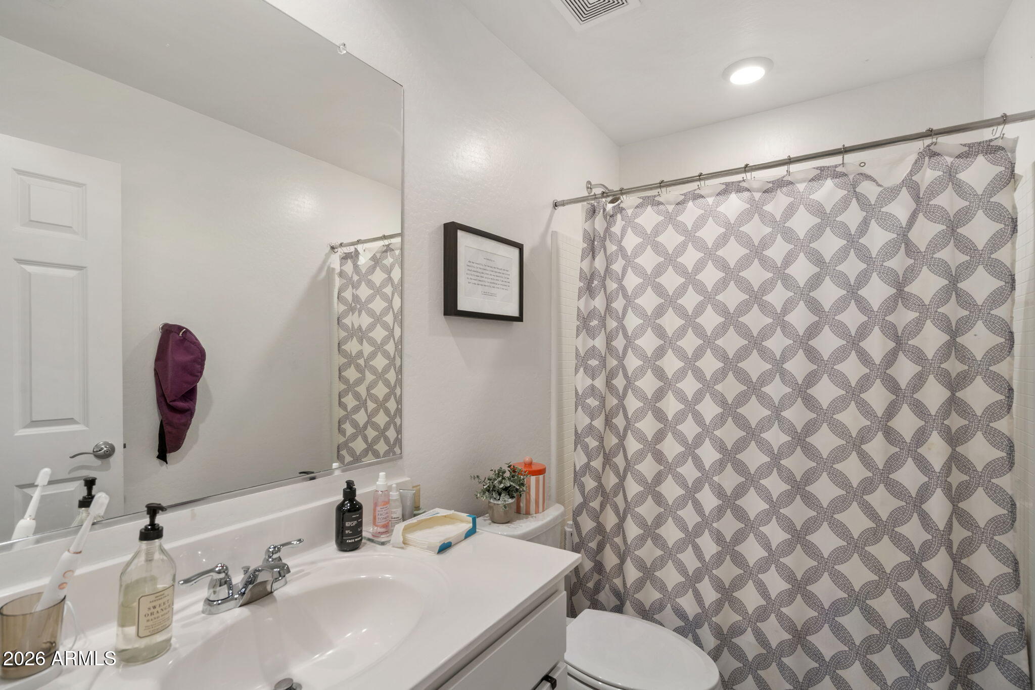 3142 Pineapple Road San Tan Valley, AZ 85143 - Photo 16 of 21 a bathroom with a sink a toilet and a mirror