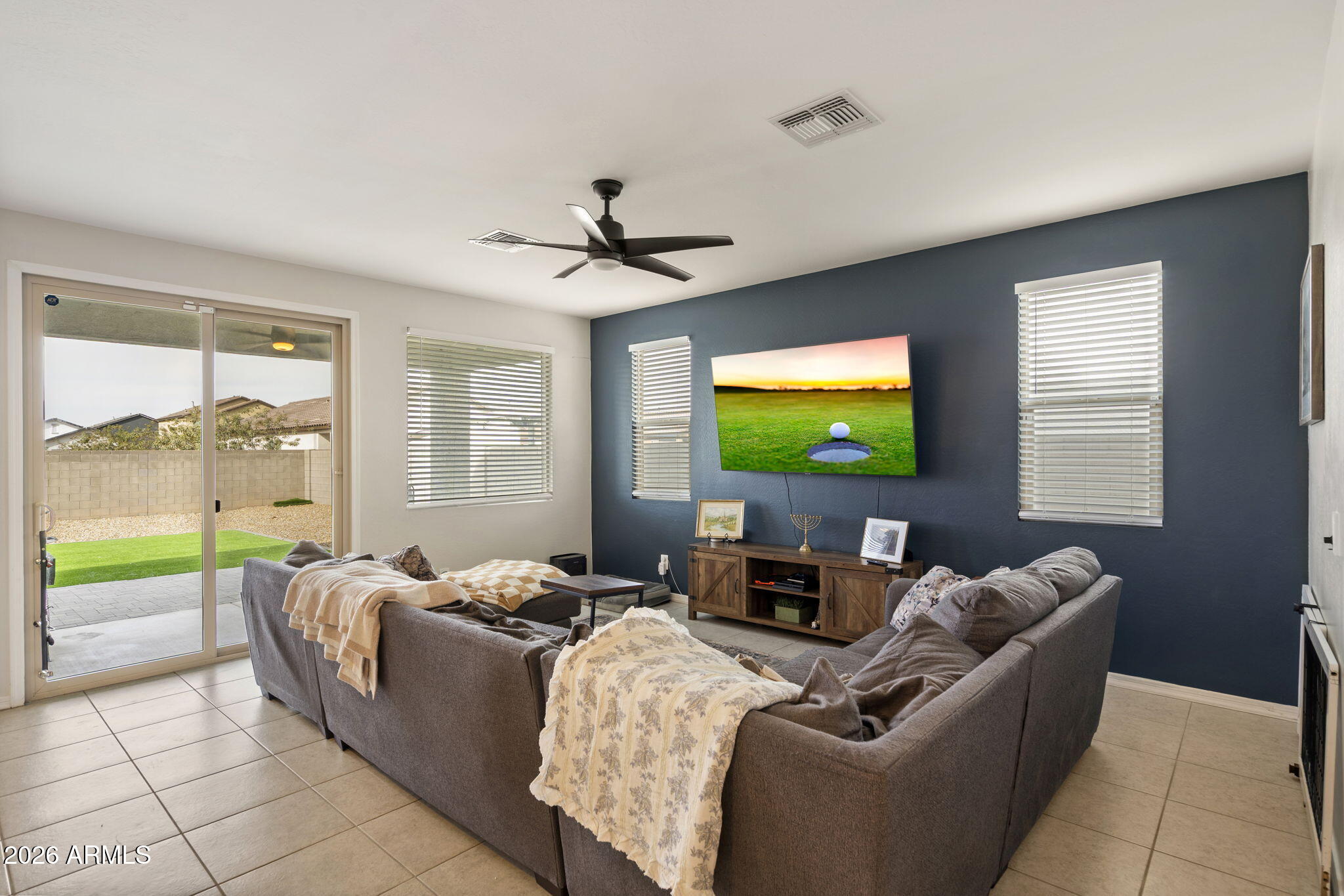 3142 Pineapple Road San Tan Valley, AZ 85143 - Photo 2 of 21 a living room with furniture and a flat screen tv