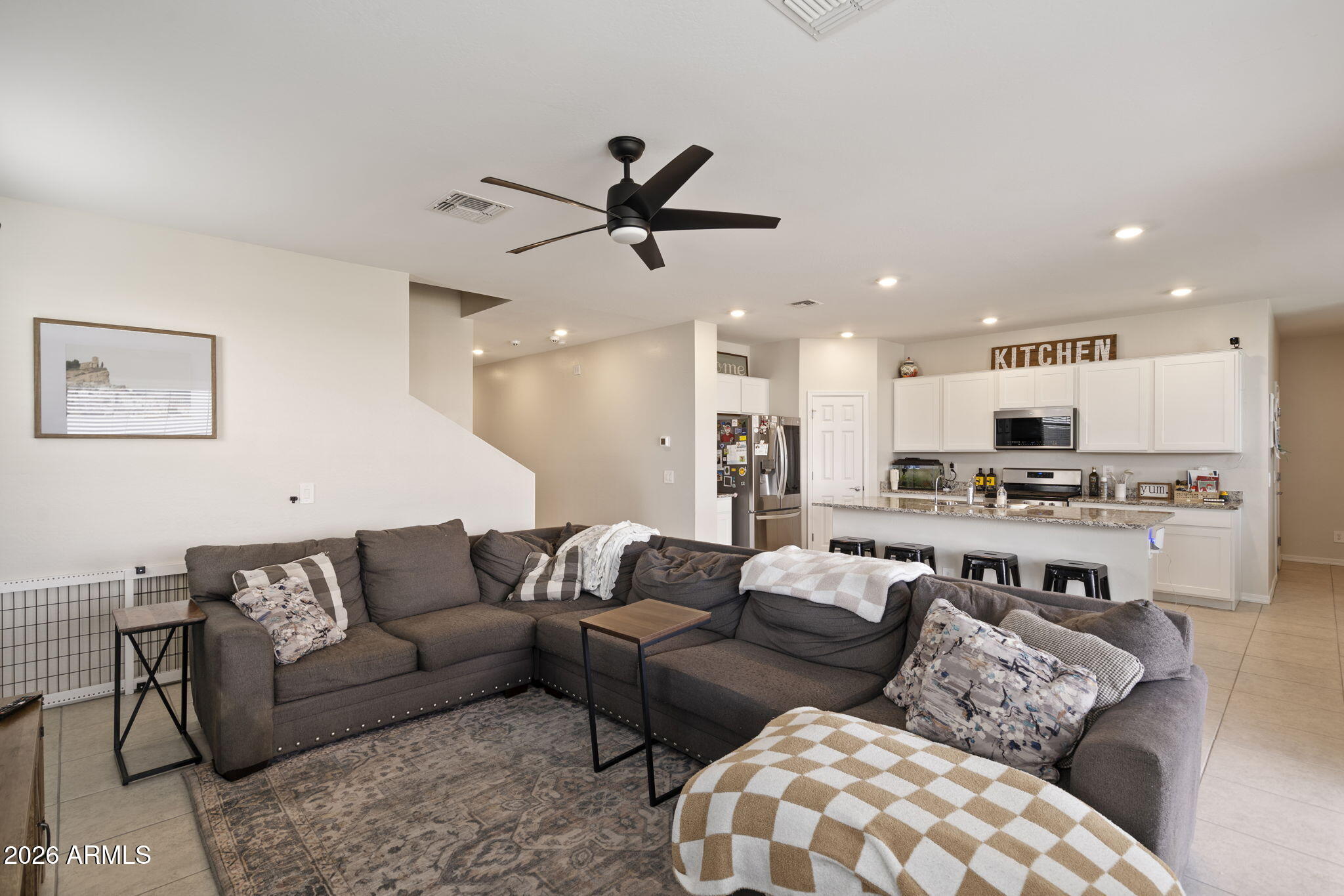 3142 Pineapple Road San Tan Valley, AZ 85143 - Photo 3 of 21 a living room with furniture kitchen and a view of kitchen