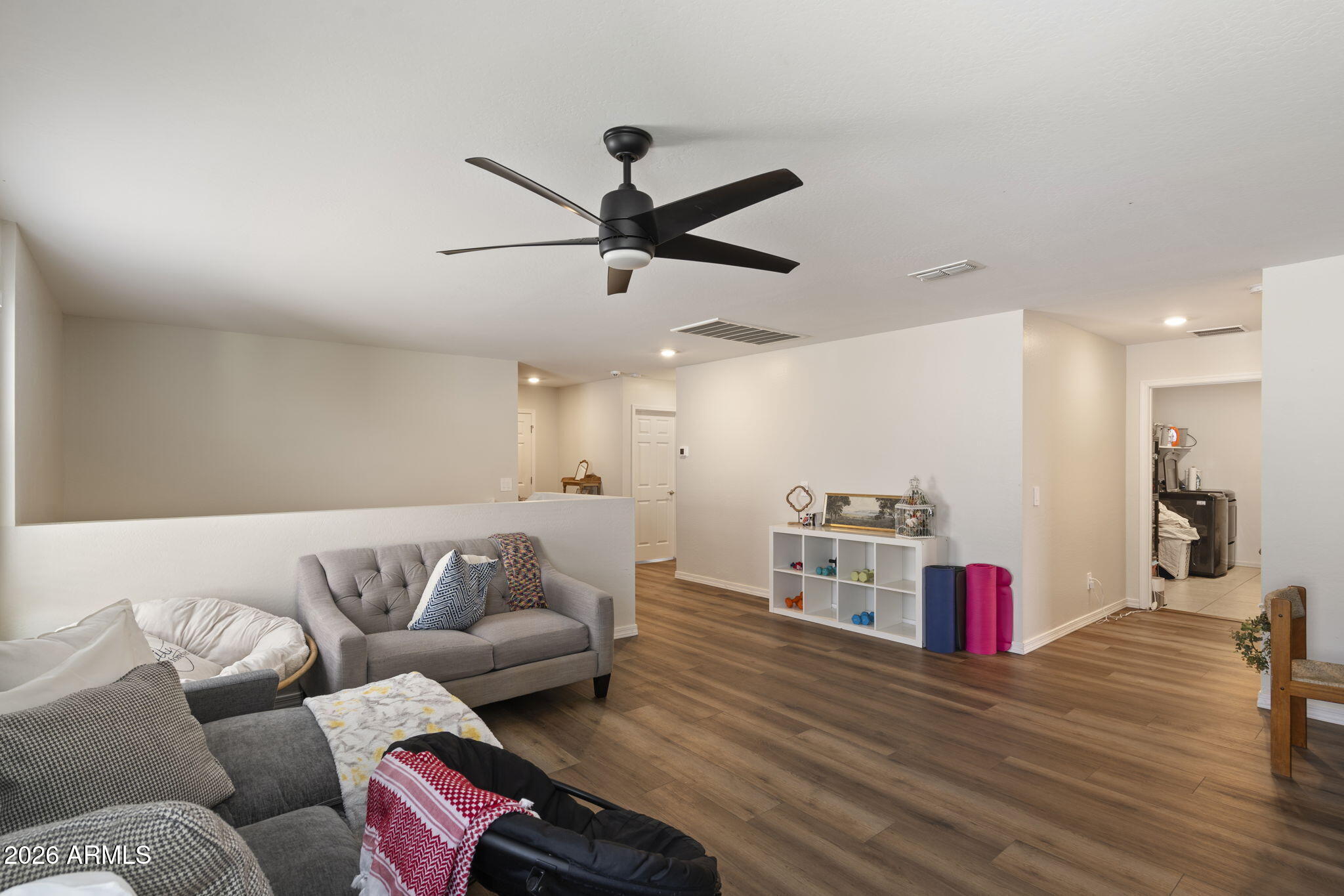 3142 Pineapple Road San Tan Valley, AZ 85143 - Photo 8 of 21 a living room with furniture kitchen view and a wooden floor