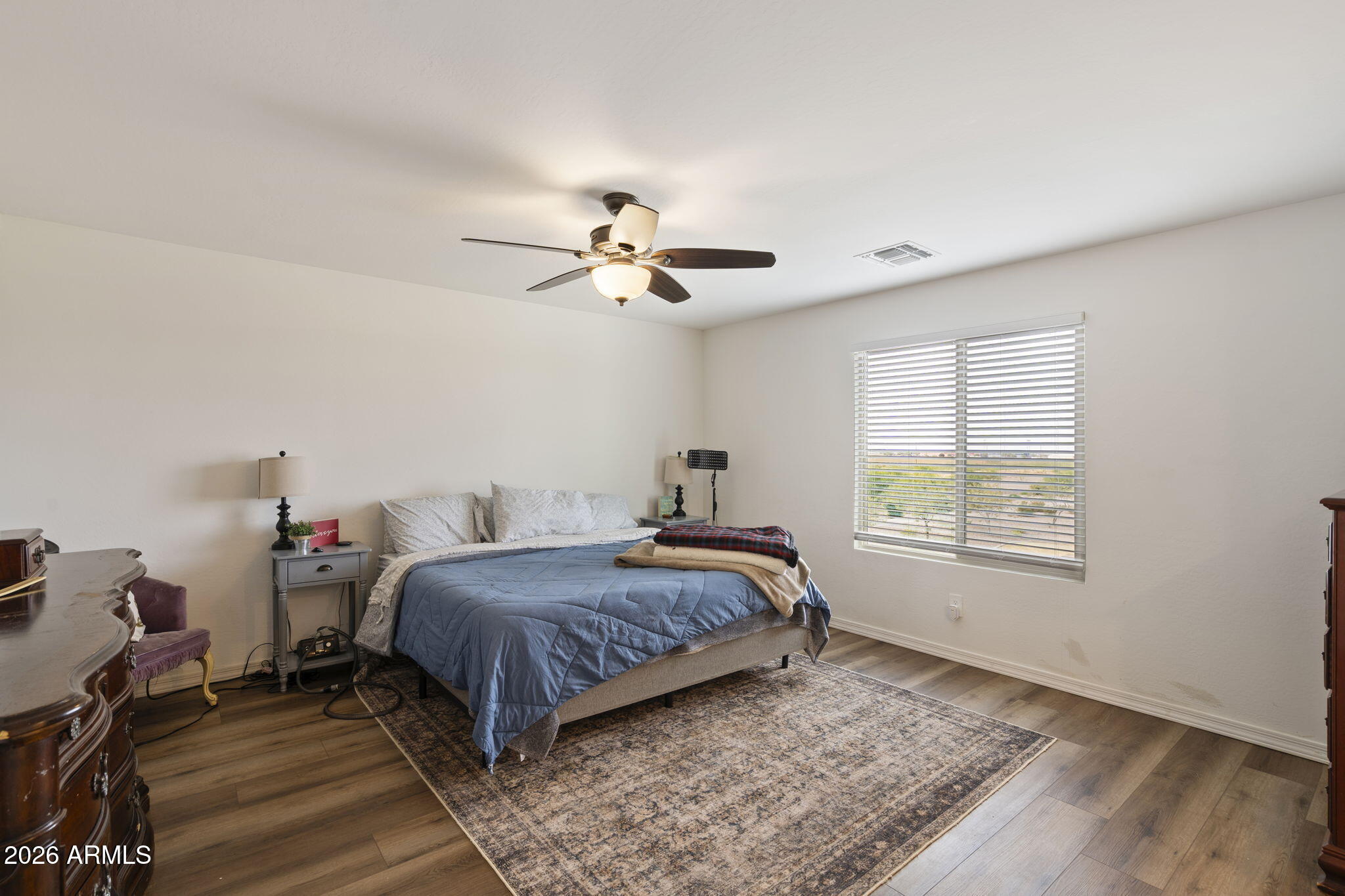 3142 Pineapple Road San Tan Valley, AZ 85143 - Photo 10 of 21 a bedroom with a bed window and a ceiling fan
