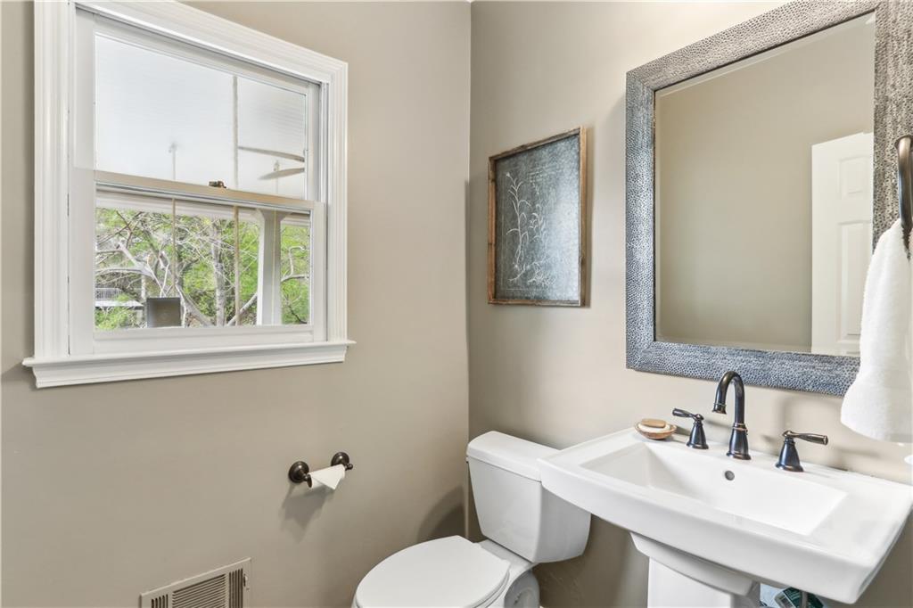 44 Pointe Terrace Southeast Atlanta, GA 30339 - Photo 13 of 31 a bathroom with a sink mirror and toilet