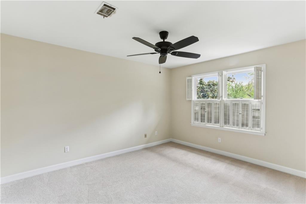 44 Pointe Terrace Southeast Atlanta, GA 30339 - Photo 23 of 31 an empty room with a window and a fan