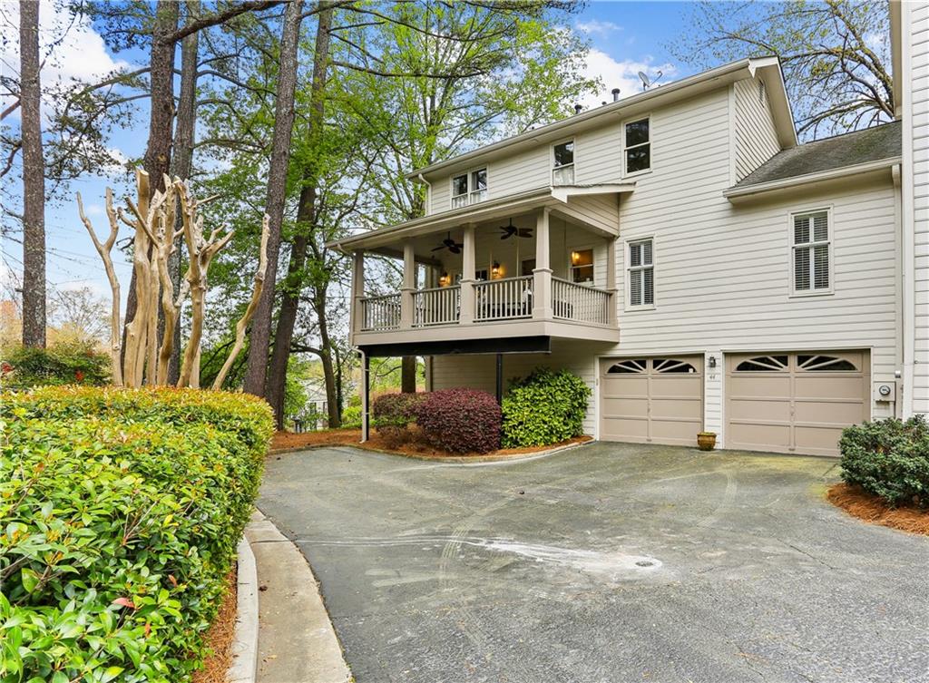 44 Pointe Terrace Southeast Atlanta, GA 30339 - Photo 31 of 31 a front view of a house with a yard and garage