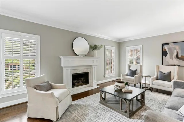 a living room with furniture and a fireplace