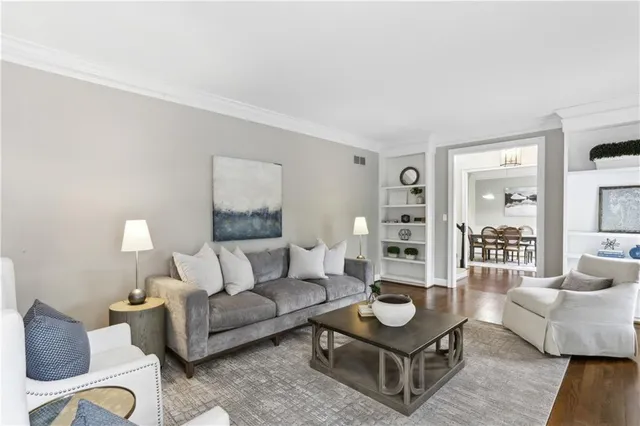 a living room with furniture and a table