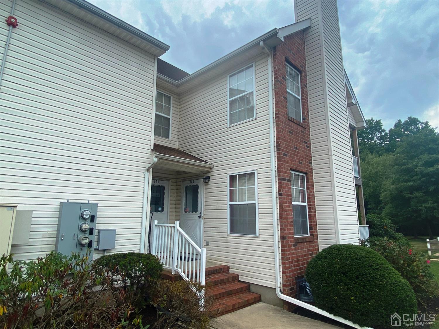 340 Bowler Court Piscataway, NJ 08854 - Photo 2 of 23 a view of a white house next to a yard