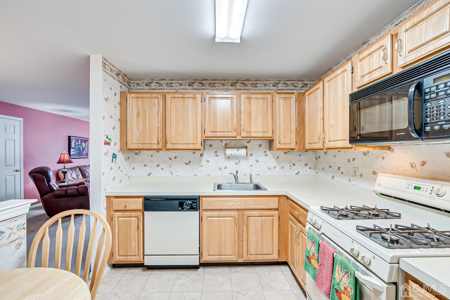 340 Bowler Court Piscataway, NJ 08854 - Photo 12 of 23 a kitchen with stainless steel appliances granite countertop a stove and a microwave
