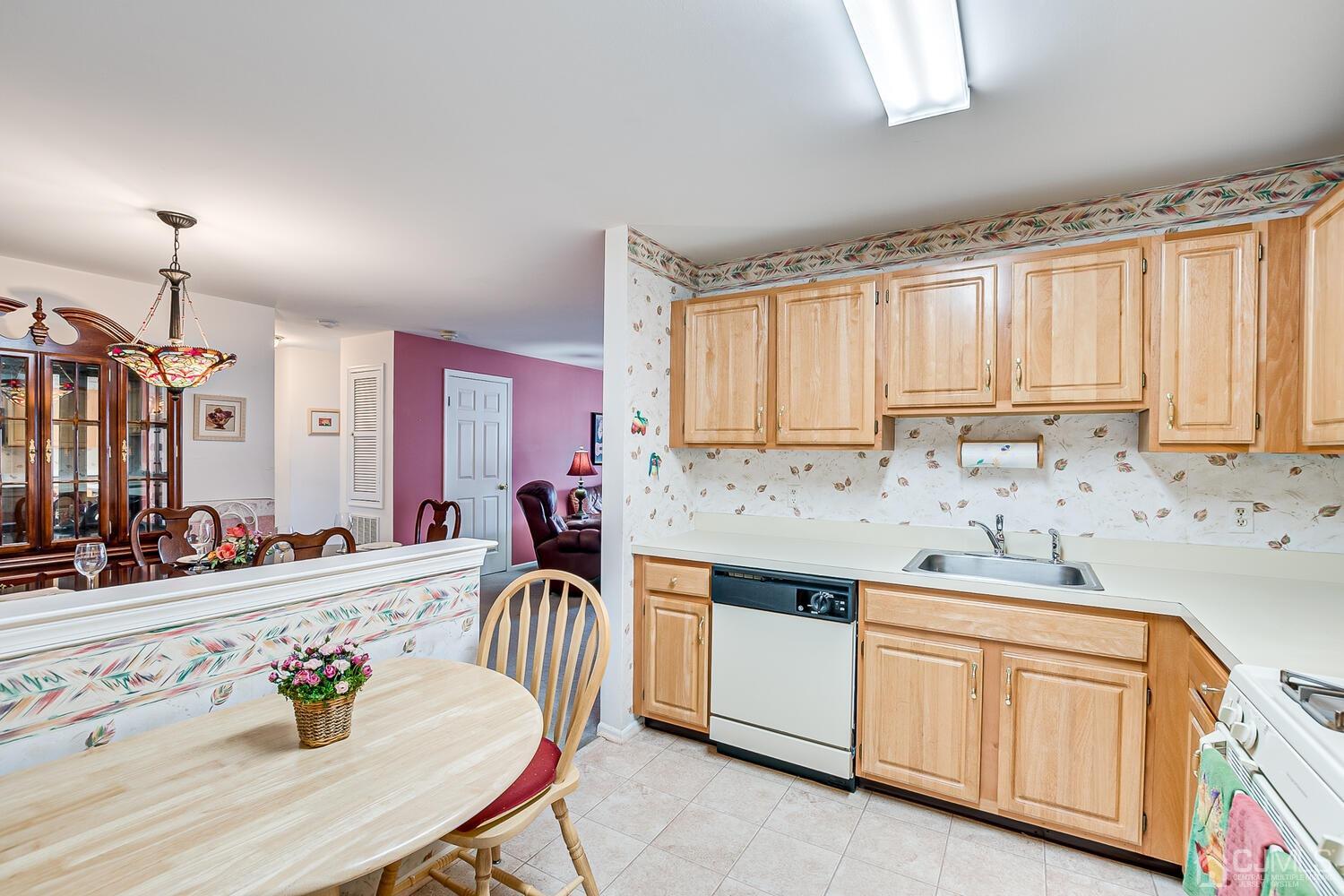 340 Bowler Court Piscataway, NJ 08854 - Photo 13 of 23 a kitchen with granite countertop a sink stove and cabinets