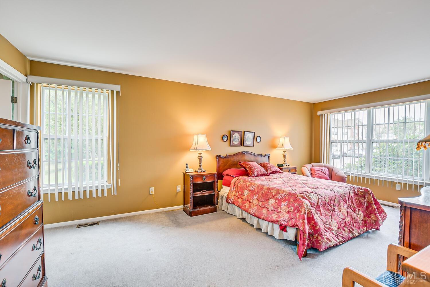 340 Bowler Court Piscataway, NJ 08854 - Photo 15 of 23 a bedroom with a bed and a large window