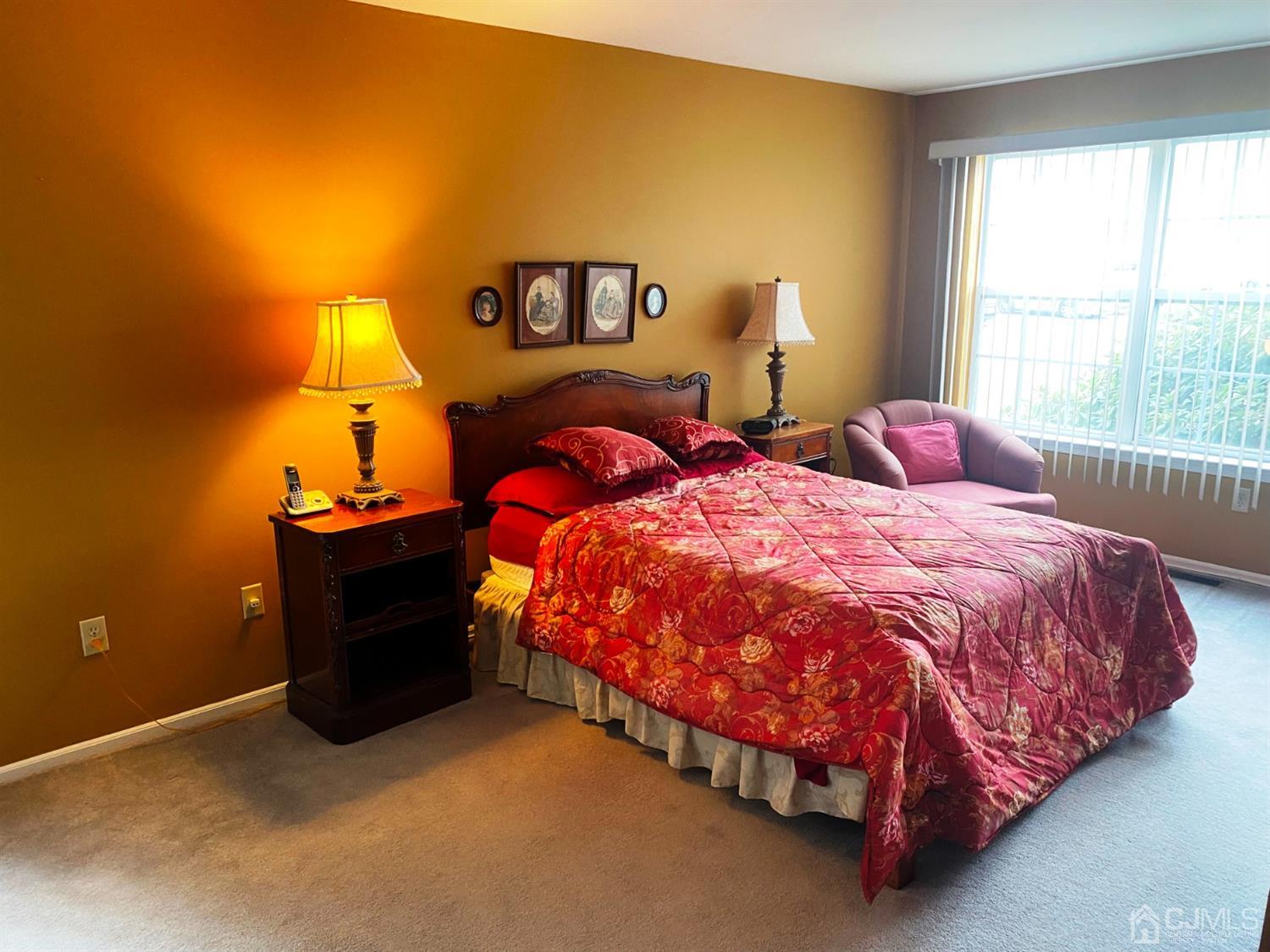 340 Bowler Court Piscataway, NJ 08854 - Photo 6 of 23 a bed sitting in a bedroom next to a window