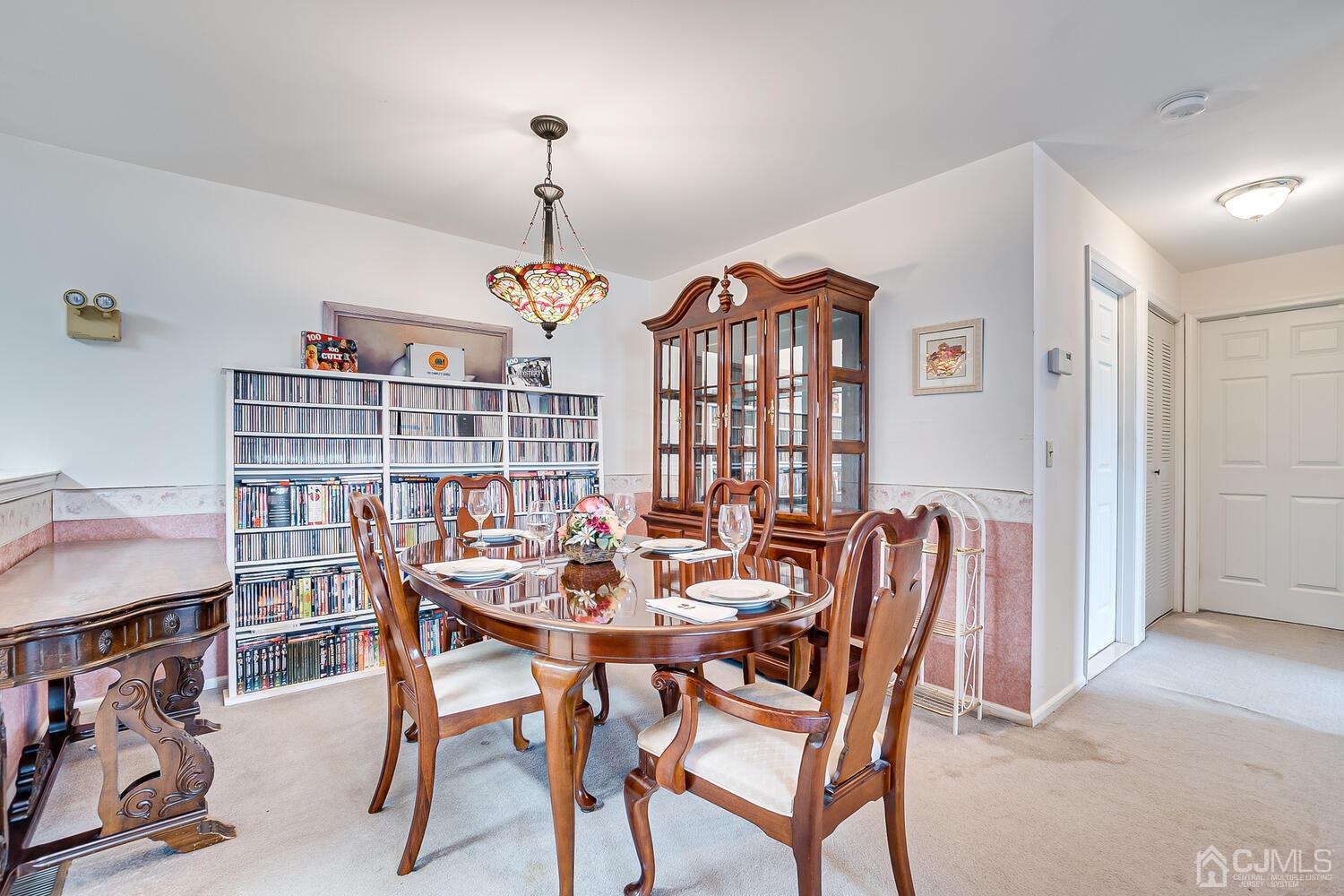 340 Bowler Court Piscataway, NJ 08854 - Photo 8 of 23 a view of a dining room with furniture and a chandelier