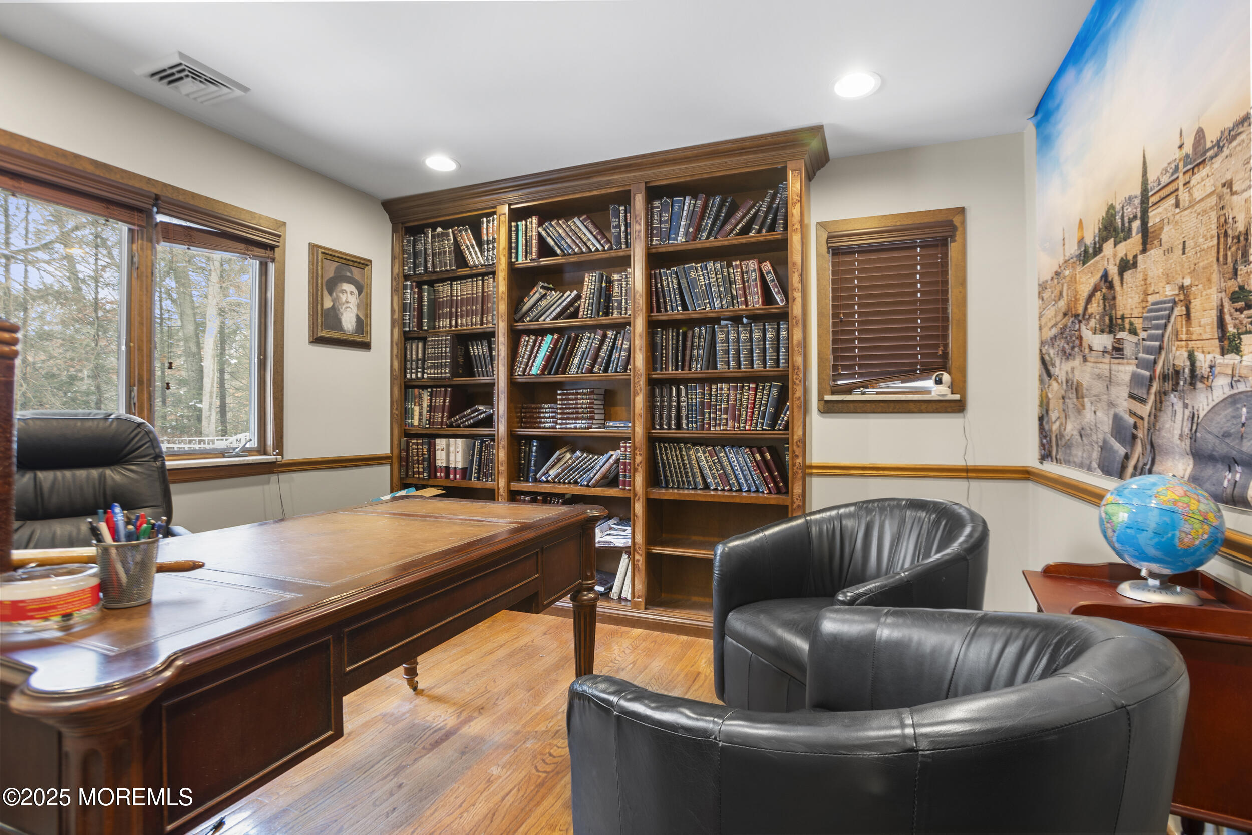 780 Green Valley Road Jackson, NJ 08527 - Photo 15 of 44 a living room with furniture and a book shelf