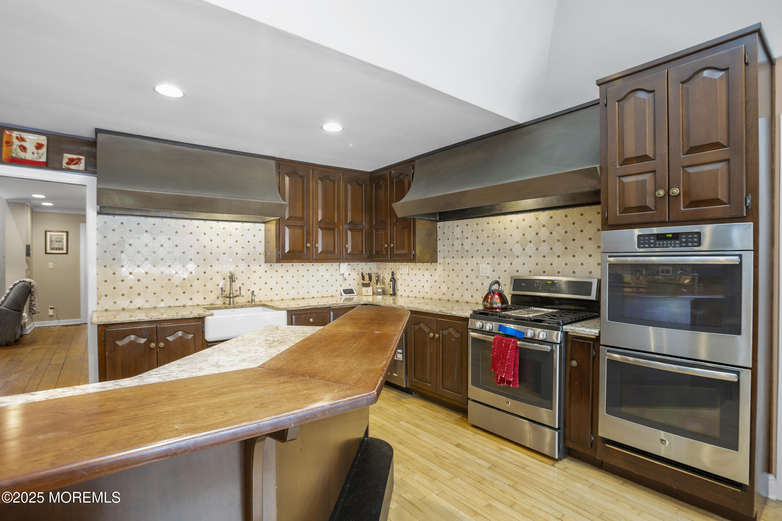 780 Green Valley Road Jackson, NJ 08527 - Photo 21 of 44 a kitchen with stainless steel appliances granite countertop a stove a sink and a refrigerator