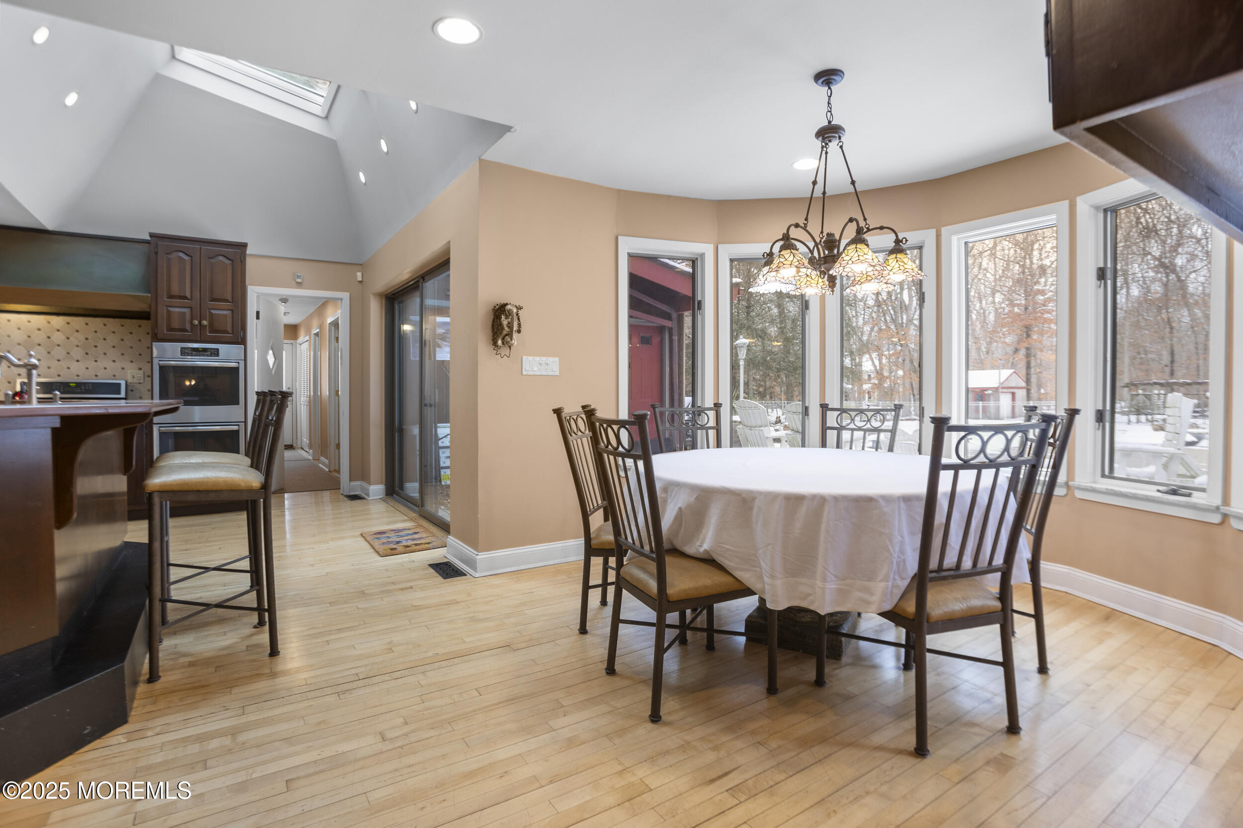 780 Green Valley Road Jackson, NJ 08527 - Photo 22 of 44 a view of a dining room with furniture window and wooden floor
