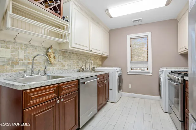 a kitchen with a sink stove and refrigerator