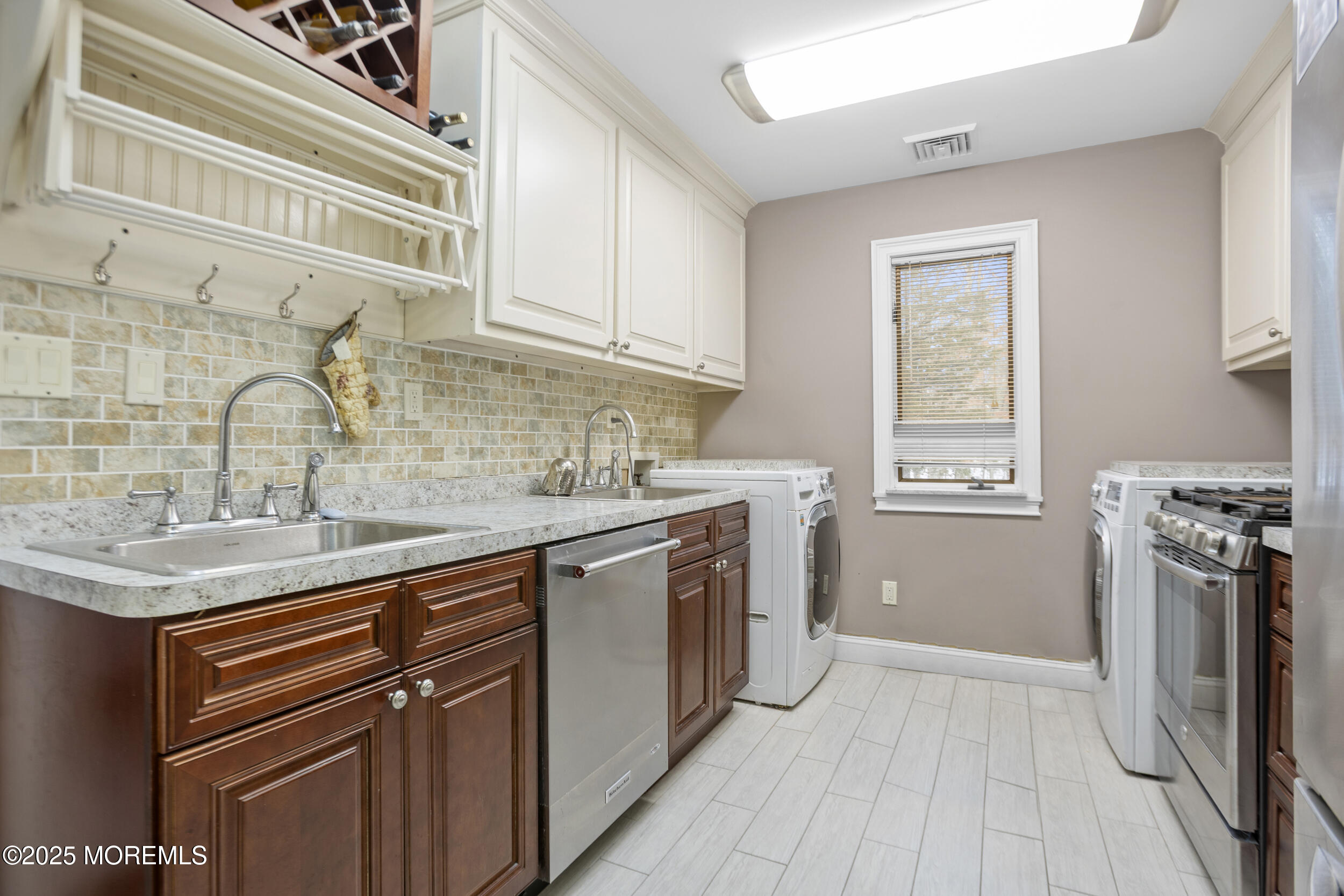 780 Green Valley Road Jackson, NJ 08527 - Photo 26 of 44 a kitchen with a sink stove and refrigerator