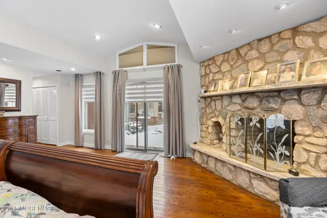 a spacious bedroom with a large bed and a window