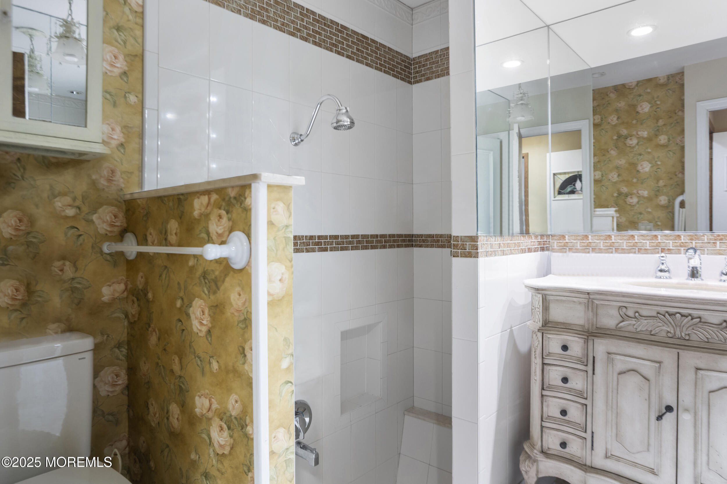 780 Green Valley Road Jackson, NJ 08527 - Photo 36 of 44 a bathroom with a granite countertop shower sink vanity and mirror