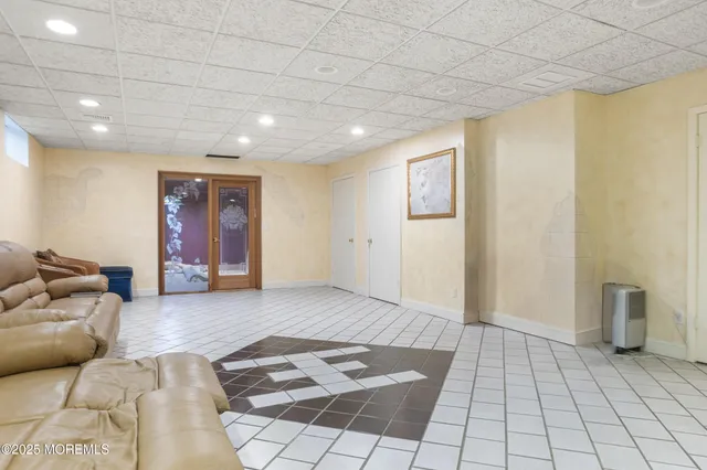 a living room with furniture and a rug