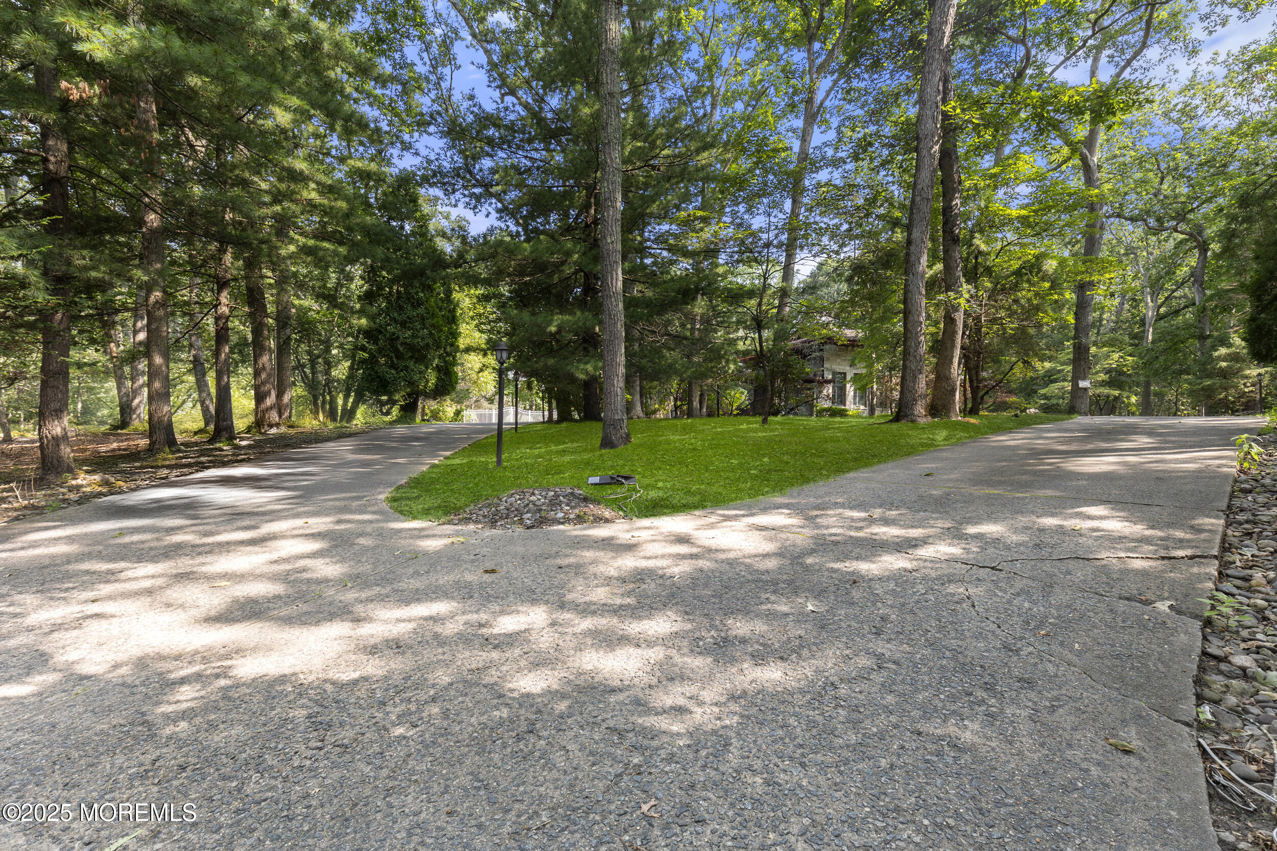 780 Green Valley Road Jackson, NJ 08527 - Photo 4 of 44 a view of a road with a trees